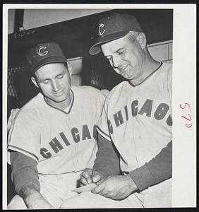 Newest Cub, former Cardinal Alvin Dark, left, gets briefing from Manager Bob Scheffing before first start with Chicago in night game with Pirates.