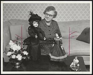 Hazel Thomas and friends-The tall doll on the left was given to her as a child, when she was ill. The doll on the right is over 100 years old.