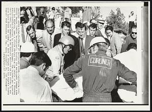 Reagan at Earthquake Scene--California Gov. Ronald Reagan (center background), touring the earthquake damage area near Los Angeles, sees a victim carries from the debris of a Veterans Administration Hospital in suburban Sylmar. The injured man appeared nearly dead, but moments later doctors reported he was alive. It was nine hours after the quake. At left of Reagan are Los Angeles County Sheriff Pete Pitchess and Rep. Barry Goldwater Jr.