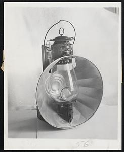 Still Popular -- A Dietz buggy lantern of the 19th century. Wired for electricity, many lamps of this sort are returning into the modern home.