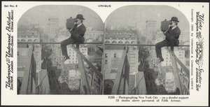 Photographing New York City, U.S.A. -eighteen stories above pavement of Fifth Avenue.