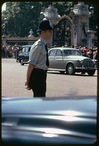 Policeman near gate of Buckingham Palace, London