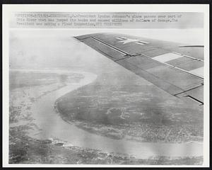 President Lyndon Johnson's plane passes over part of Ohio River that has jumped its banks band caused millions of dollars of damage. The President was making a flood inspection.
