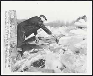 Mail Call-- Maynard King checks mail at Hardwick, Vt., but only deposit was several hundred tons of ice dropped on street by flash flood today following record thaw.
