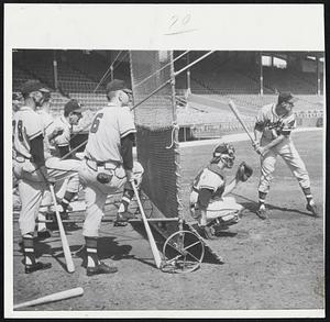 Taking Batting Practice is Joe Adcock of the league-leading Milwaukee Braves at Busch Stadium, St. Louis., where they will play the Cards tonight. Watching in rear of backstop are, left to right, Gene Conley, Bill Bruton, Danny O'Connell and Jack Dittmer.