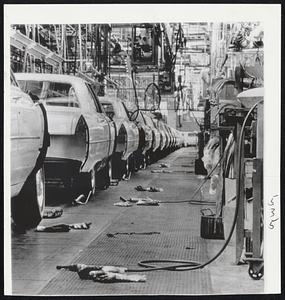 Tools and gloves lie where they were dropped along final assembly line of General Motors plant in Detroit, after it was struck by United Auto Workers Union members.