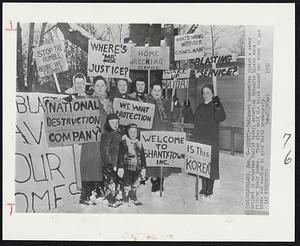 Quiet!--Indignant housewives picket a sewer project in suburban Euclid today, asserting dynamite blasts were ruining their homes. They also said the noise caused one woman to get hives and another to give birth prematurely.