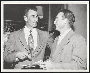 Cubs Confer at Hotel Kenmore before leaving for last night's game with Braves at the Wigwam. Left is Hank Sauer, with Frankie Baumholtz.