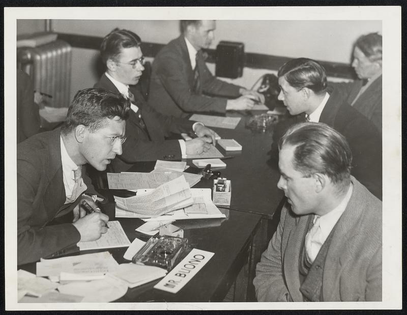 Homeless men, right, registering at the transients division of federal emergency relief, at 199 Cambridge street, yesterday. Hundreds of wandering, jobless men who have [illegible] camp at Wakefield.