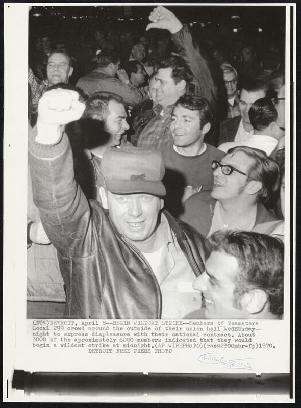 Begin Wildcat Strike -- Members of Teamsters Local 299 crowd around the outside of their union hall Wednesday night to express displeasure with their national contract. About 3000 of the approximately 6000 members indicated that they would begin a wildcat strike at midnight.