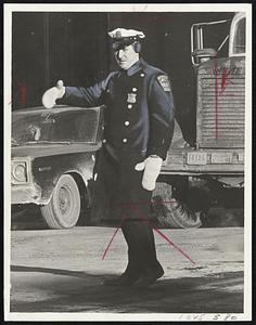 Patrolman Steve Gaffney directs traffic at Tremont and Boylston streets.