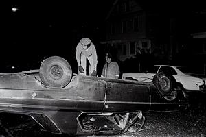 Chelsea Fire E2 Lt Adolph Spinazolla as Jerry's Towing driver Paul Koolloian prepares to upright the rolled over vehicle