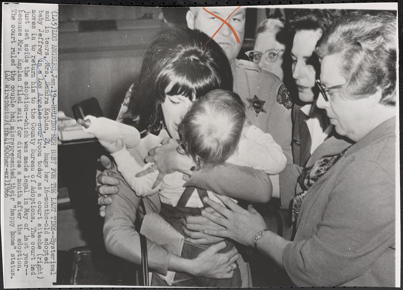 Holding her baby for the last time-hysterical and in tears