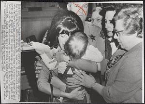 Holding her baby for the last time-hysterical and in tears