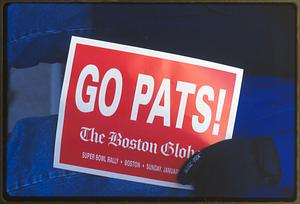 Boston City Hall Plaza (circa 1997) a New England Patriots fan holds up a sign