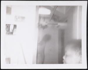 Profile shot of a boy in a doorway