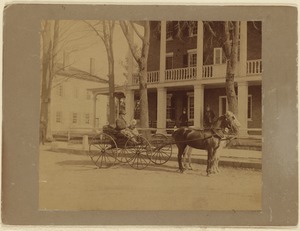 Curtis Hotel: man and child in carriage in front