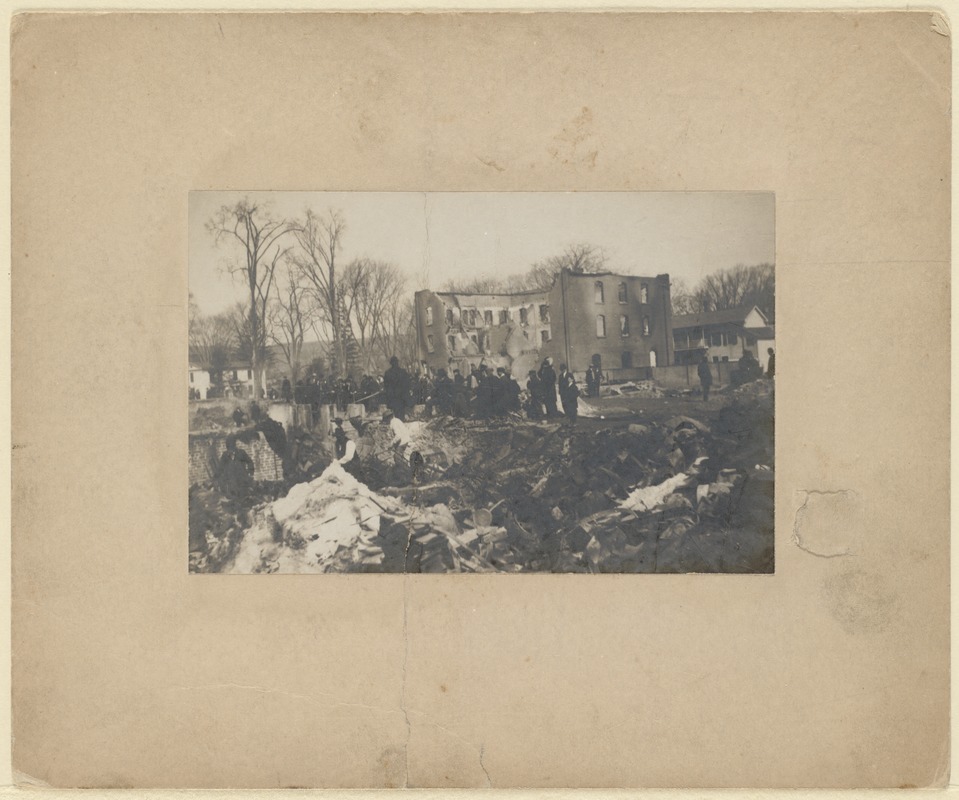 Easter Fire: large group of people and brick shell