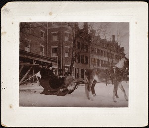 Curtis Hotel: man, woman & three children in horse-drawn sleigh in front of hotel