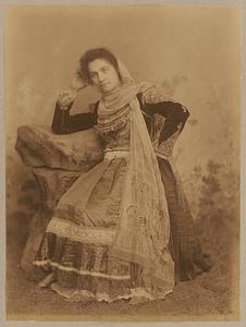 Studio portrait of woman in traditional Greek dress