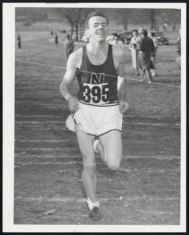 Meet The Champ - New England cross country champion is Ed Shea, shown hitting the finish in yesterday's 41st NE hill and dale meet to win the individual title hands down although his team, Northeastern, was beaten out by one point for the team title by Massachusetts.