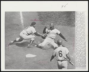 Out in Try for the Plate-Ruben Amare, Philadelphia shortstop, is tagged out as he tries to slide past Mets catcher Joe Pignatano in fourth inning of first game of a double header at New York's Polo Grounds today. Amare tried to score from third when Pignatano threw to second in attempt to pick off Phillies Tony Taylor. Return throw by New York's Charlie Neal was in time for the out. John Callison (6) of the Phillies was at bat when the play began. Philadelphia won, 9-3.