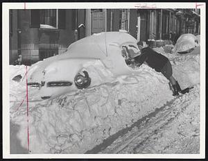 Way Down Under was where Alona Elliott of Newton found her car yesterday. Automobile was left at Beacon street opposite the Common during storm, was thoroughly plowed-in and snowed-in during the night.