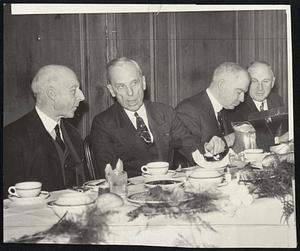 Left to right—Charles Francis Adams, Alfred P. Sloan, Jr., Eliot Wadsworth, and Alvan T. Fuller, at table, yesterday.
