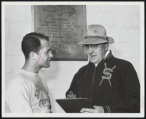 Syracuse Univ. crew coach Loren Schoel and team captain Jim Kries plot a victory over Harvard, BU and MIT this Saturday.