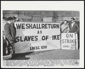 USW Display Feelings-This sign created at the Beech Bottem plant of the Wheeling Steel Corporation shows USW local 1201's dissatisfaction over the back-to-work Taft-Hartley injunction edict. Union members are shown preparing to erect the sign to replace the "on strike" sign.