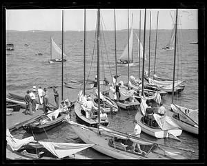 Sailboats on and by a dock