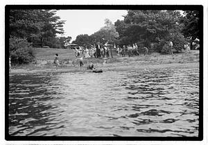 Boys sending out model sailboats