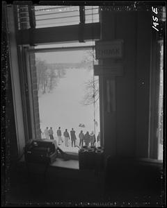 Students outside seen through a window