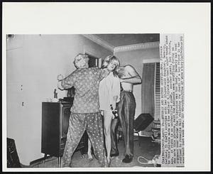 Beverly and Mother Scuffle--Mrs. Florence Aadland, 53 (left) scuffles with her 17-year-old daughter, Beverly, in this picture made at the Aadland Hollywood apartment about three weeks ago. At right is an unidentified guest. Another guest, Bob Profeta, who made this picture, said the Aadlands were scuffling during an argument over whether the television was too loud. Beverly had been confined to Juvenile Hall following the death of a boy friend in her apartment last week end.