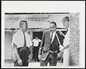 King Visits Fasting Clergymen in Prison - Dr. Martin Luther King (center) and Rev. Ralph D. Abernathy (left) talk to a reporter after they visited 17 fasting white clergymen in Lee County stockade today. The clergymen, mostly from New York and Chicago, were among 75 persons jailed Tuesday for holding a prayer vigil in front of city hall in protest to segregation. The churchmen refused to eat as part of their "moral witness" against racial barriers in this southwest Georgia city.