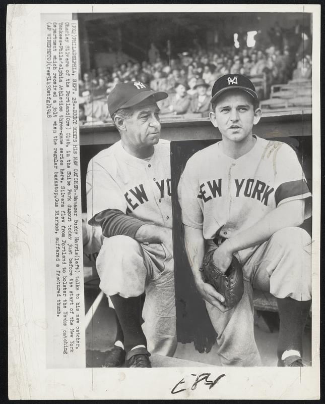 Bucky Meets his New Catcher--Manager Bucky Harris (left) talks to his new catcher, Charley Silvera of the Portland(Ore) Club, in the Shibe Park dugout today just before the start of the New York Yankees-Philadelphia Athletics three-game series here. Silvera flew from Portland to bolster the Yanks catching department which received a jolt when the regular backstop, Niarhos, suffered a fractured thumb.