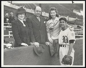 The Sisti Family has a Reunion at Braves Field as Sibby Sisti, Braves' second baseman poses with his bride and his parents. The new Mrs. Sisti, who was Mirime M. Barone before their marriage in December, came to Boston this week-end, with Sibby's parents, Mr. and Mrs. Dan Siti, to set up house-keeping. And, having made the home nice and comfortable, everyone went to Braves Field where the Tribal victory over the Phils made the feeling even more comfortable and pleasant.