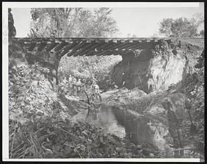 Restoring Train Service Between Lawrencr and Haverhill, Workmen Repaira Culvert Washed Out by Flood Waters That Accompanied Saturday's Hurricane. Trains on the Boston and Maine's Portland Division Are Due to be Using the Road Today.