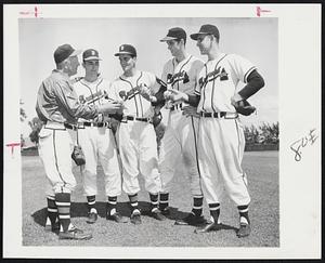 Present Arms, Baseball Style – Manager Charley Grimm of the Braves, left, checks the pitching grips of four hurlers at Bradenton. Left to right, Grimm, Johnny Antonelli, Murray Wall, Gene Conley and Ray Crone.