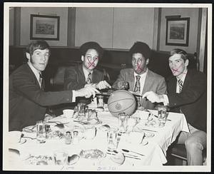 Slicing Up are captains Kevin Shea, Northeastern; Richie Taylor, Boston University; Dale Dover, Harvard and Jim O'Brien, Boston College, at Beanpot Basketball luncheon yesterday at Boston Garden. Tournament is on Tuesday December 1. Boston University opens with Harvard, followed with Boston College taking on Northeastern.