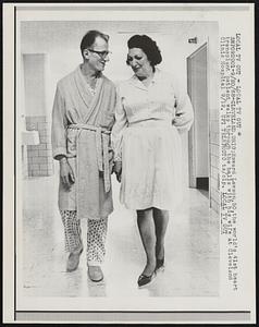 Howard Lawson, 50, the world's 41st heart transplant patient walks through the halls with his wife at Cleveland Clinical Hospital 9/19.