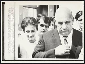 Sentenced-- Former Newark Mayor Hugh J. Addonizio and his daughter Carol leave federal court in Trenton Tuesday after Addonizio was sentenced to 10 years and a $25,000 fine for an extortion and conspiracy conviction. He is free on bail pending appeal.