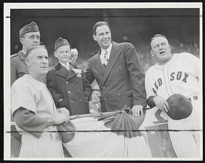 First Official Pitch at Fenway Park yesterday with Gov. Tobin winding up as Capt. John B. Murdock, Earl Mack of the Athletics, the Governor's son and Manager Joe Cronin of the Sox do the watching.