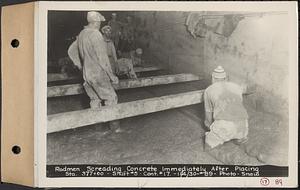 Contract No. 17, West Portion, Wachusett-Coldbrook Tunnel, Rutland, Oakham, Barre, rodmen screeding concrete immediately after placing, Sta. 377+00, Shaft 5, Rutland, Mass., Nov. 4, 1930