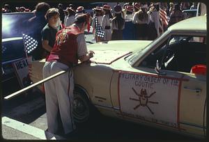 Car with a sign for Military order of the Cootie, Boston Columbus Day Parade 1973