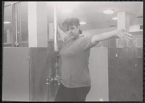 Anna posing next to a pipe