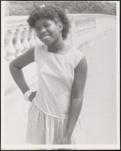Smiling girl posing on bridge
