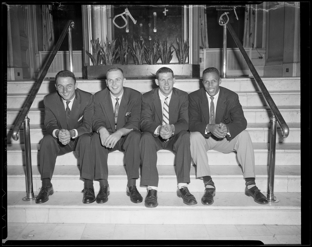 Unidentified group of men sitting on steps