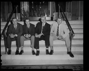 Unidentified group of men sitting on steps