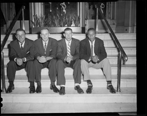 Unidentified group of men sitting on steps